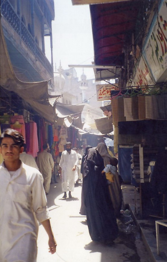 Chowk Yadgaar, bazaar with the old Mughal (17th C) Mosque rising in the background.