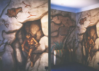 This humorous mural was inspired by the original carved Neolithic stone embedded in the wall- centre-left of photo on the right.