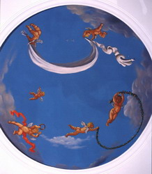 Angels painted in a cupola of a domed bathroom.